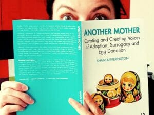Shanta Everingon holding her publication Another Mother