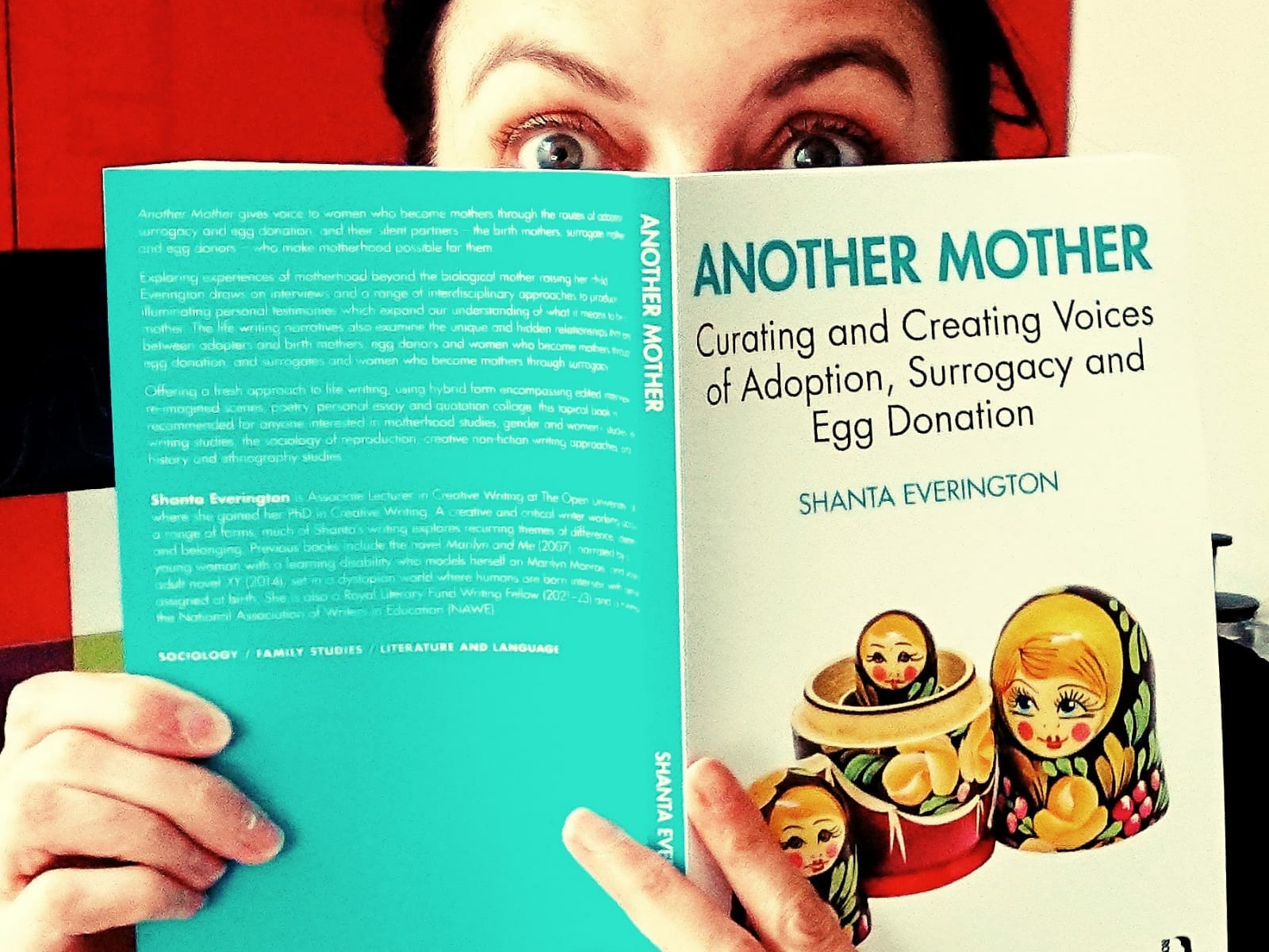 Shanta Everingon holding her publication Another Mother