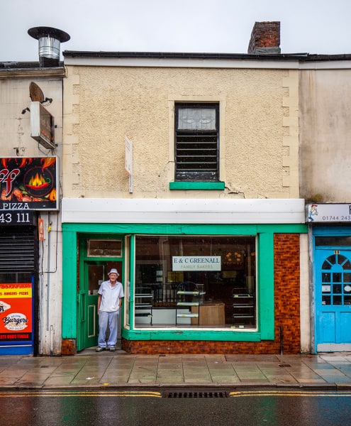 Colin Greenall, baker, outside his shop