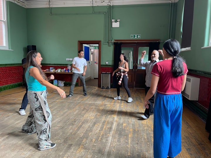 Photo of workshop with volunteers for theatre production inspired by 'Who am I?' oral history project