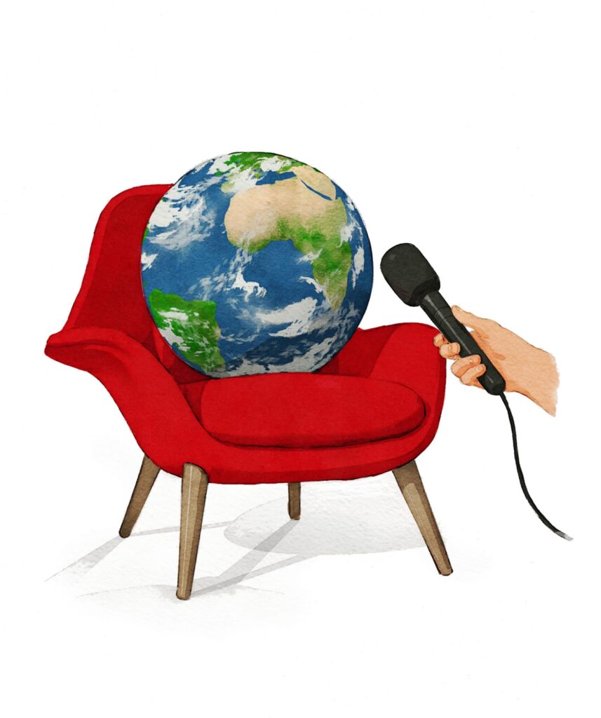 Globe in armchair with interviewing microphone